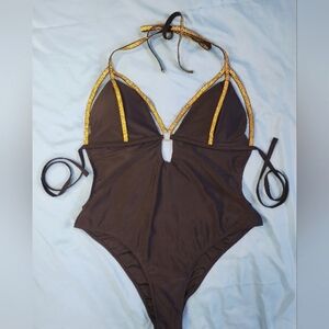 Black monokini with gold eyelet details